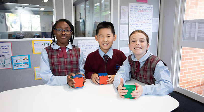 Students building cubes together in the classroom at St Bernadette's Primary School Dundas Valley