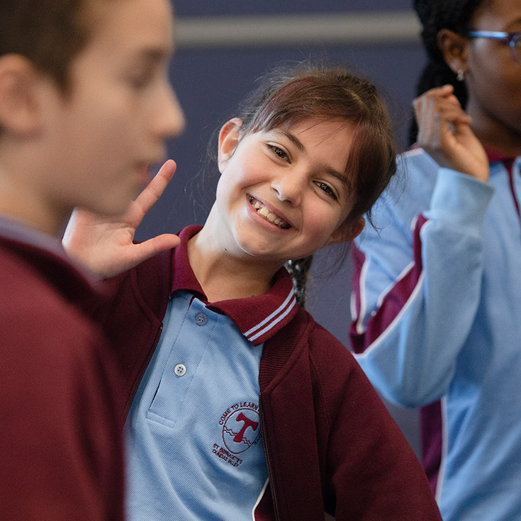 Student smiling in the classroom at St Bernadette's Primary School Dundas Valley